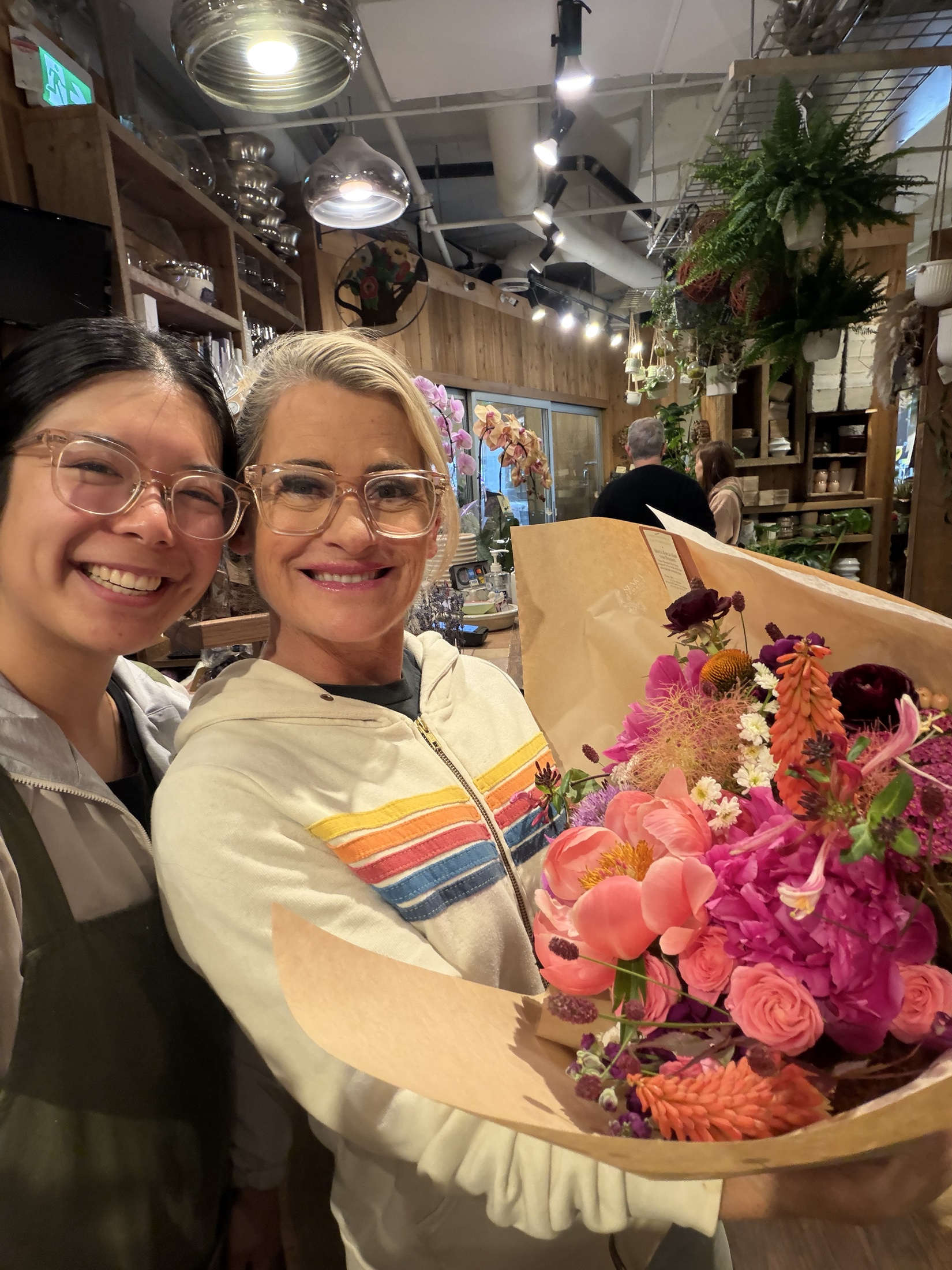 Deb collecting her colorful wedding bouquet