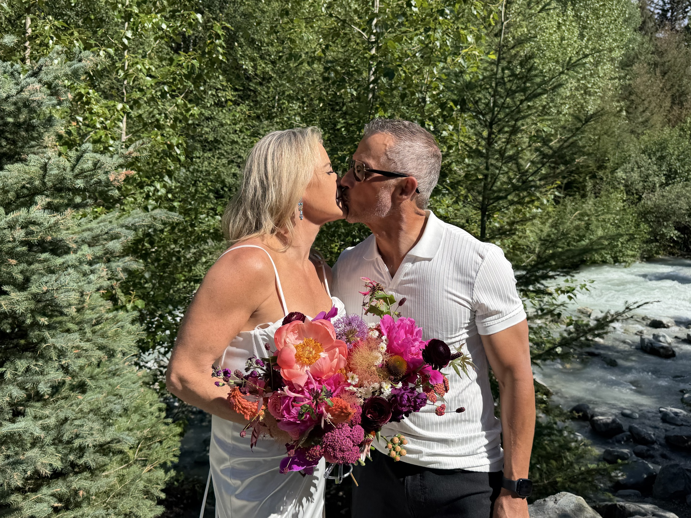 Deb and Daryl sharing a kiss beside the river